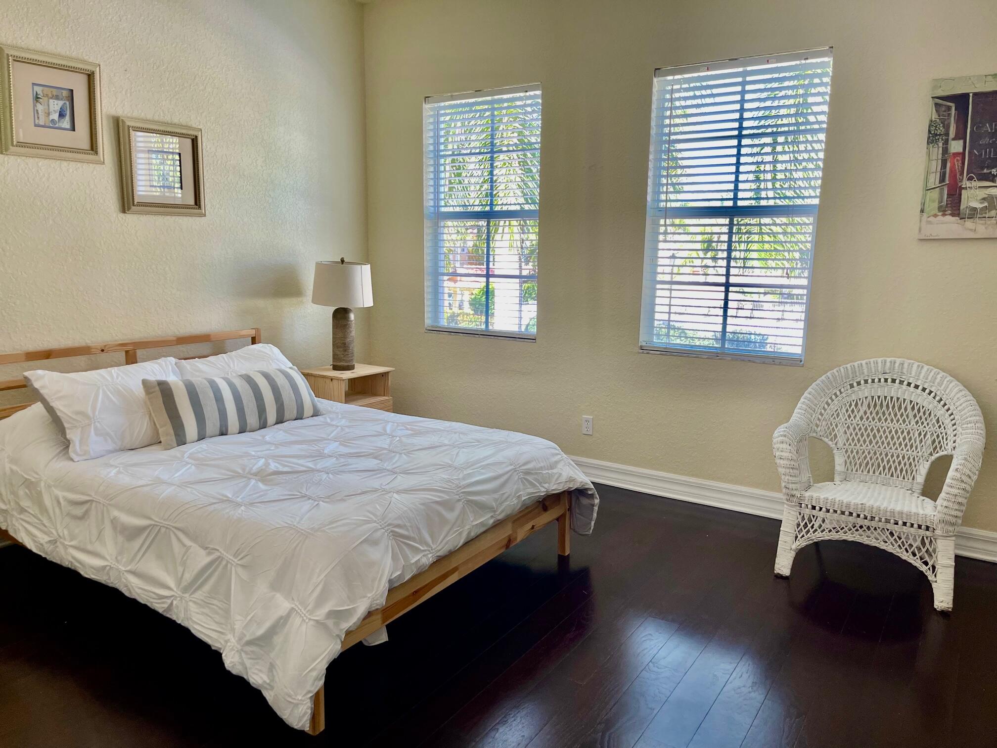 107 Mulligan Place Jupiter, FL 33458 - Photo 21 of 43 a bedroom with a bed and window