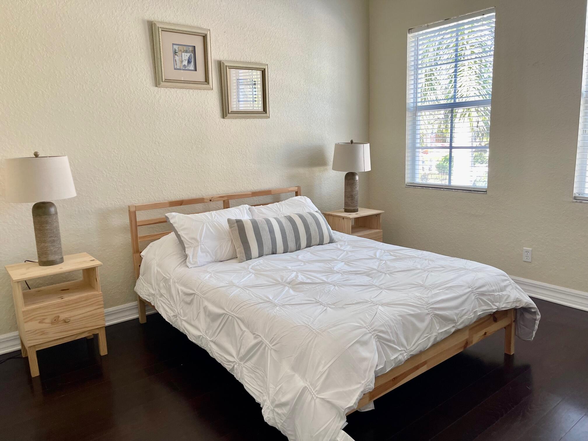 107 Mulligan Place Jupiter, FL 33458 - Photo 22 of 43 a bedroom with a bed and window