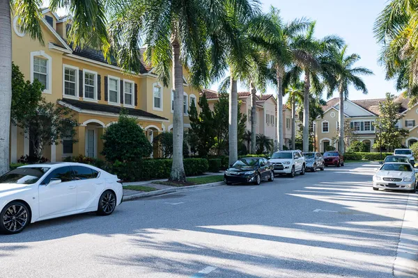 a view of a cars parked in front of a house