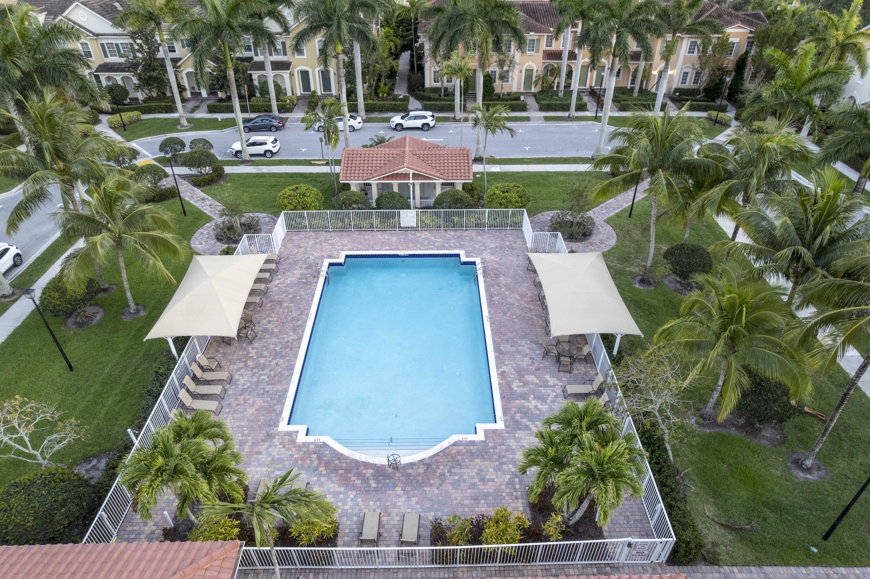 107 Mulligan Place Jupiter, FL 33458 - Photo 4 of 43 an aerial view of a house with outdoor space