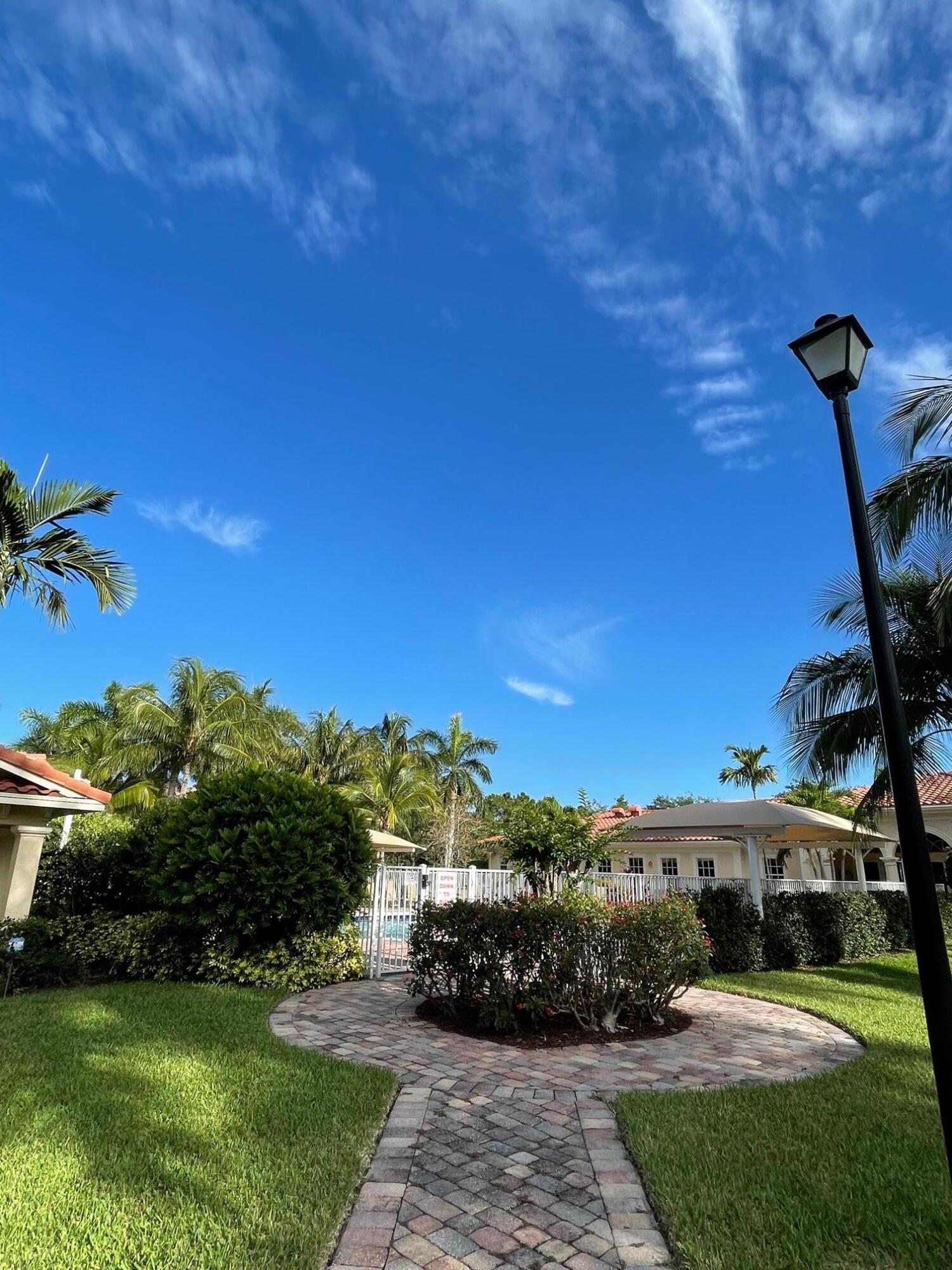107 Mulligan Place Jupiter, FL 33458 - Photo 41 of 43 a view of a street with a building in the background