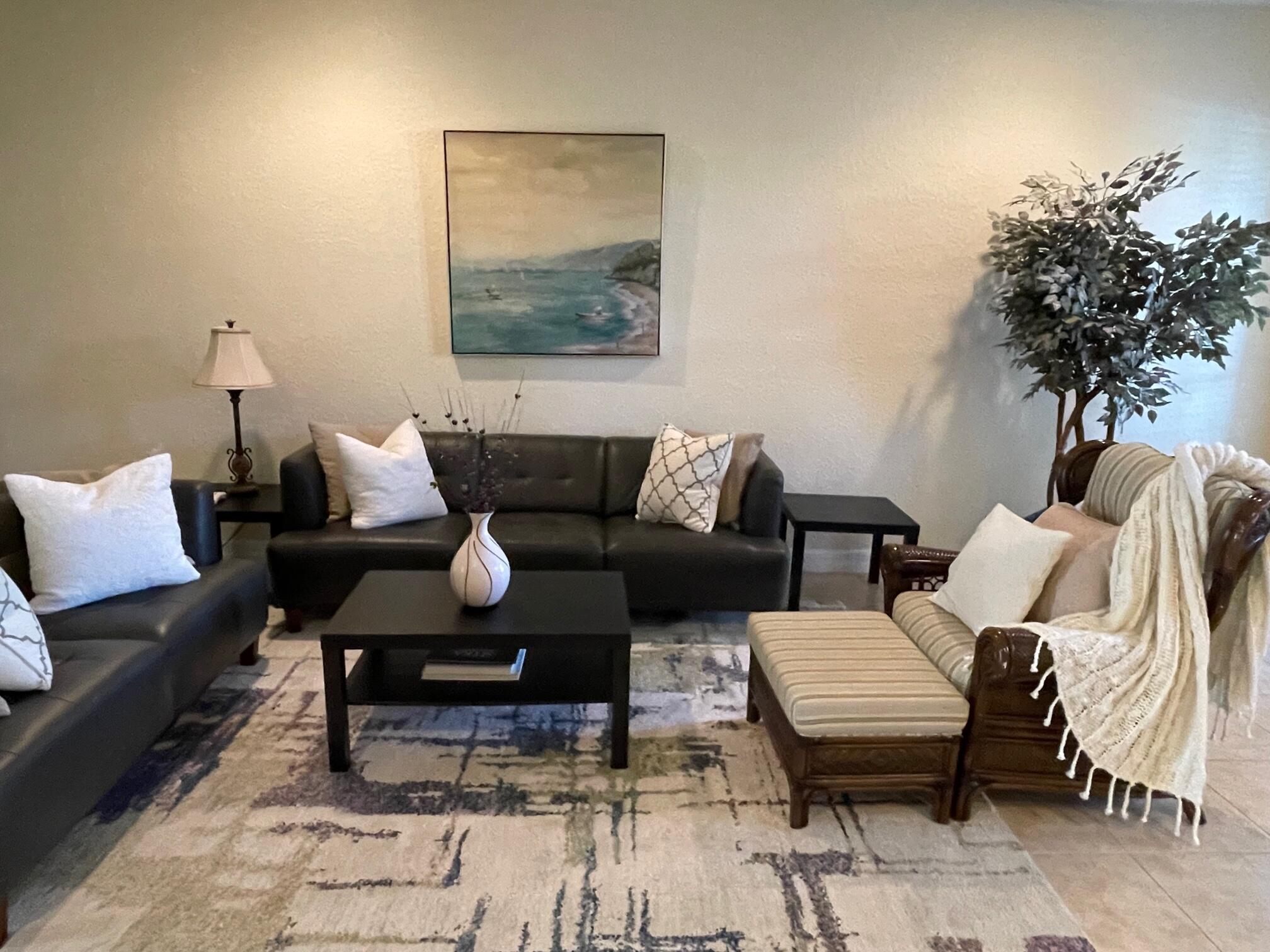 107 Mulligan Place Jupiter, FL 33458 - Photo 9 of 43 a living room with furniture and a potted plant