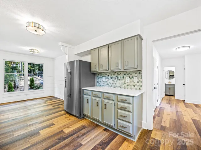 a kitchen with stainless steel appliances a stove and a refrigerator
