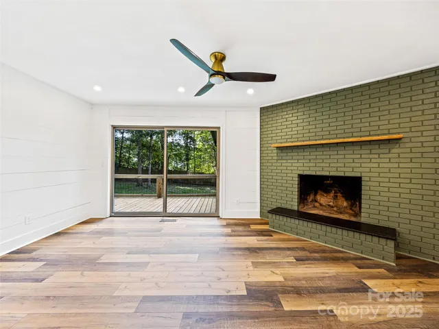 a living room with a fireplace and a rug