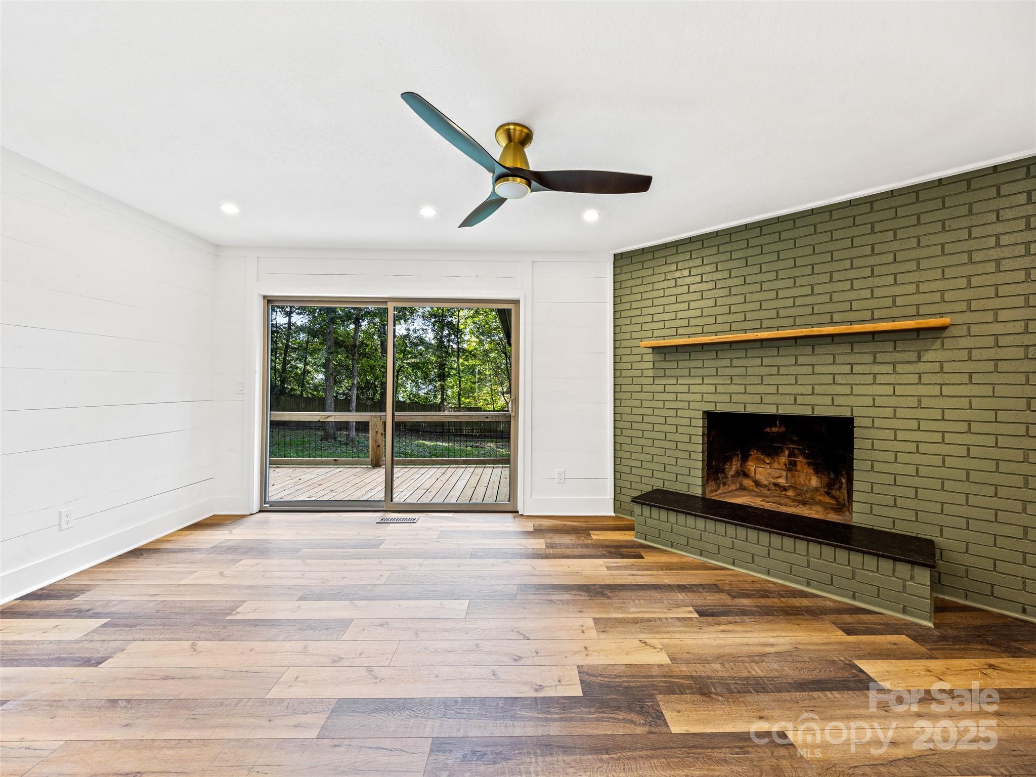 10 Westfield Road Fletcher, NC 28732 - Photo 23 of 45 a living room with a fireplace and a rug