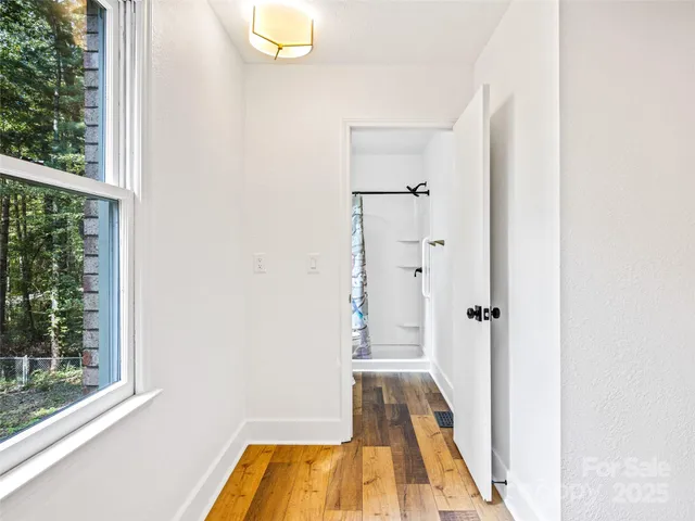 a bathroom with a tub and shower