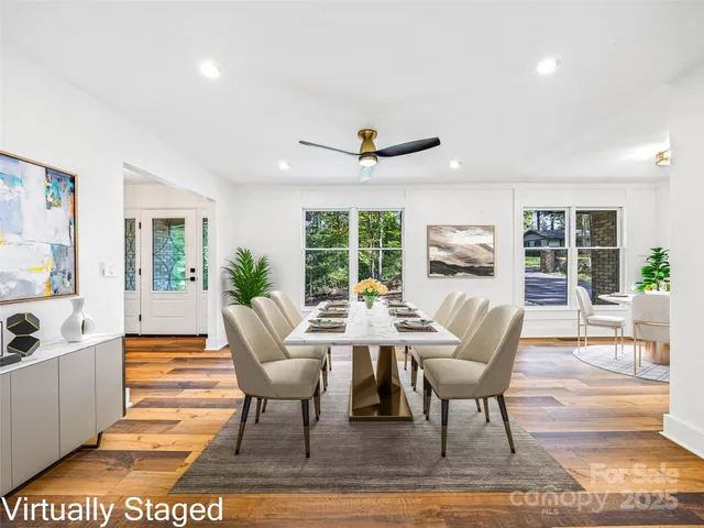 a view of a dining room with furniture window and wooden floor