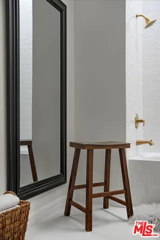 a view of an empty room and wooden floor