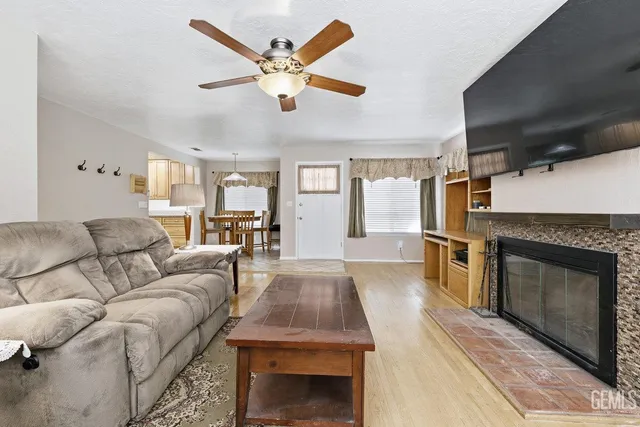 a living room with furniture and a fireplace