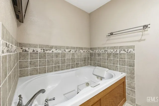 a bathroom with a bath tub