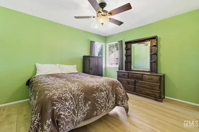 a bedroom with a bed and a dresser