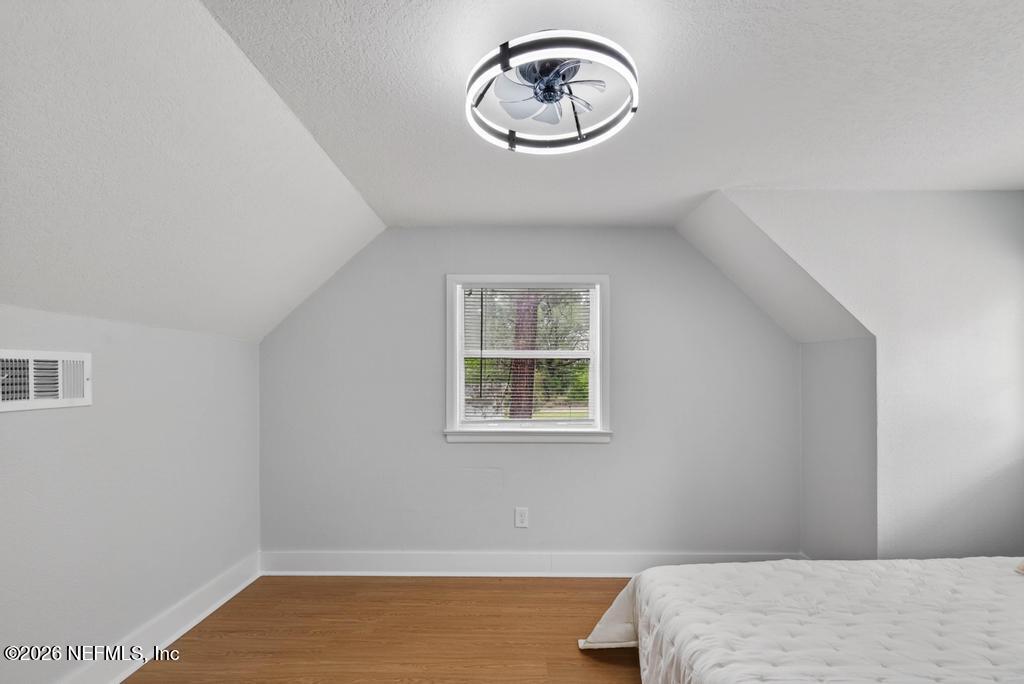 43739 Ratliff Road Callahan, FL 32011 - Photo 46 of 55 a bedroom with a bed and a window