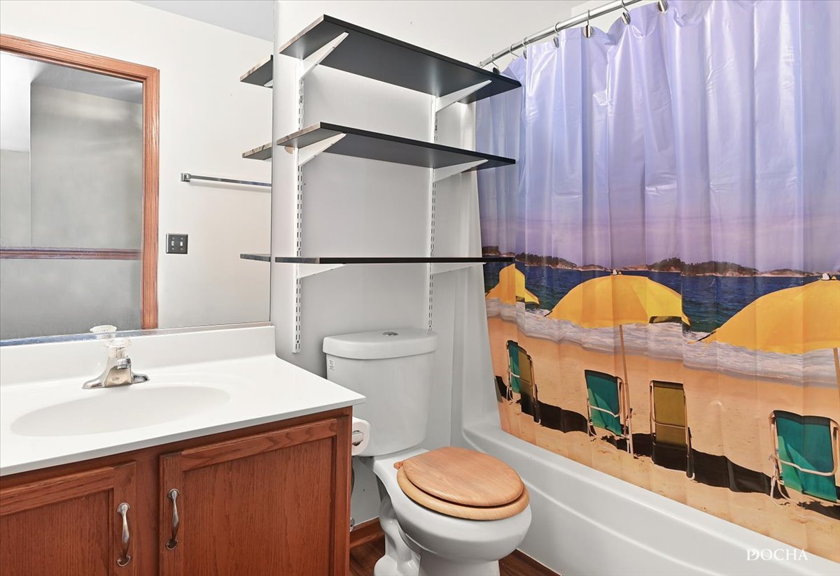 649 Chestnut Ridge Minooka, IL 60447 - Photo 14 of 20 a bathroom with a sink a toilet and shower