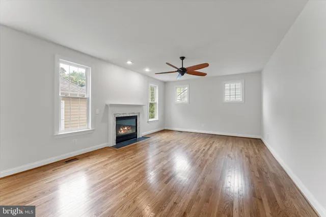 a living room with furniture fireplace and window