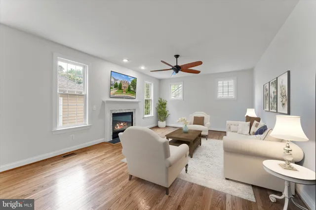 a view of a kitchen with a fireplace and wooden floor