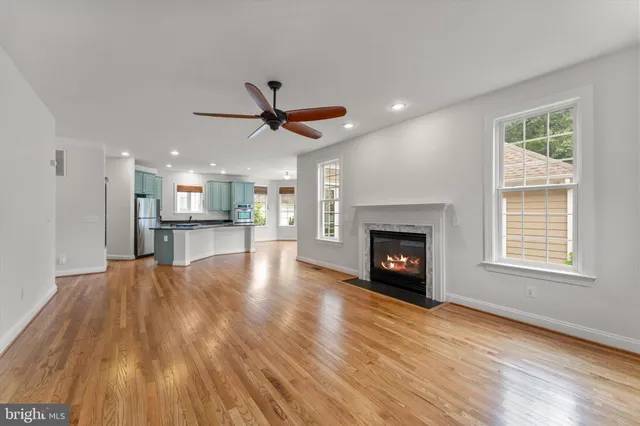 a view of a kitchen with a sink and wooden floor