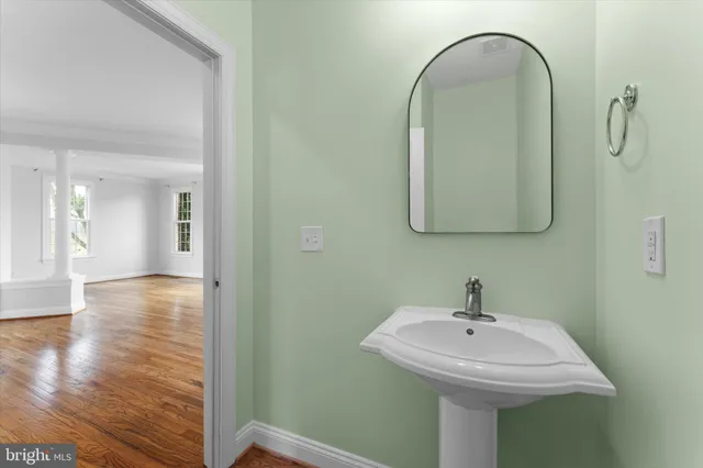 a view of hallway with wooden floor