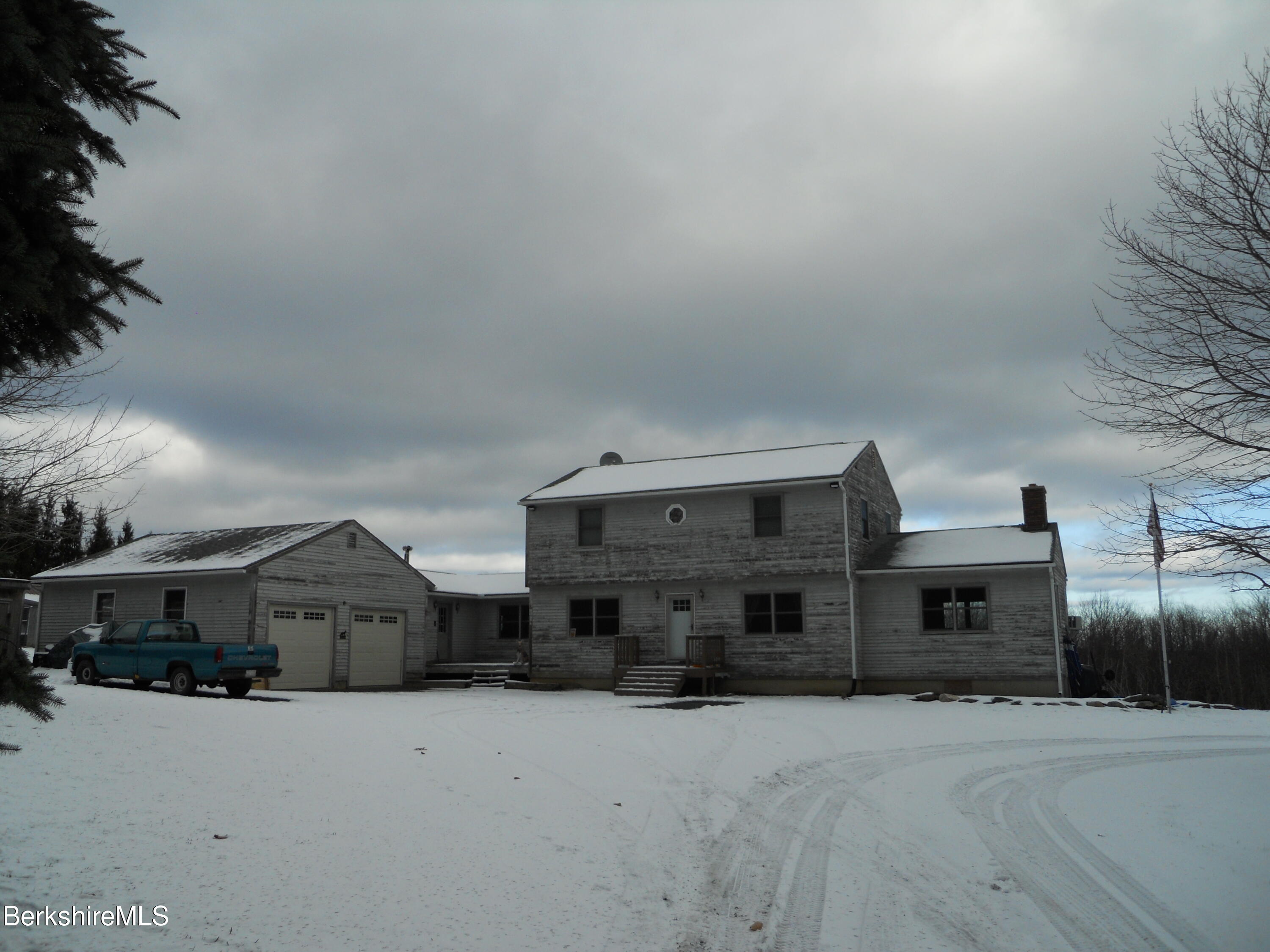 140 Arthur Pease Road Middlefield, MA 01011 - Photo 2 of 43 a front view of a house with parking space