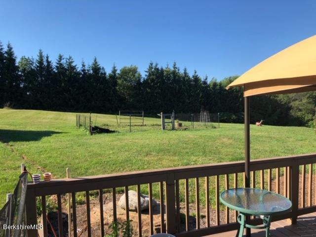 140 Arthur Pease Road Middlefield, MA 01011 - Photo 11 of 43 a view of a deck with a big yard