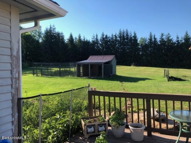 140 Arthur Pease Road Middlefield, MA 01011 - Photo 12 of 43 a view of a white house with a ocean view