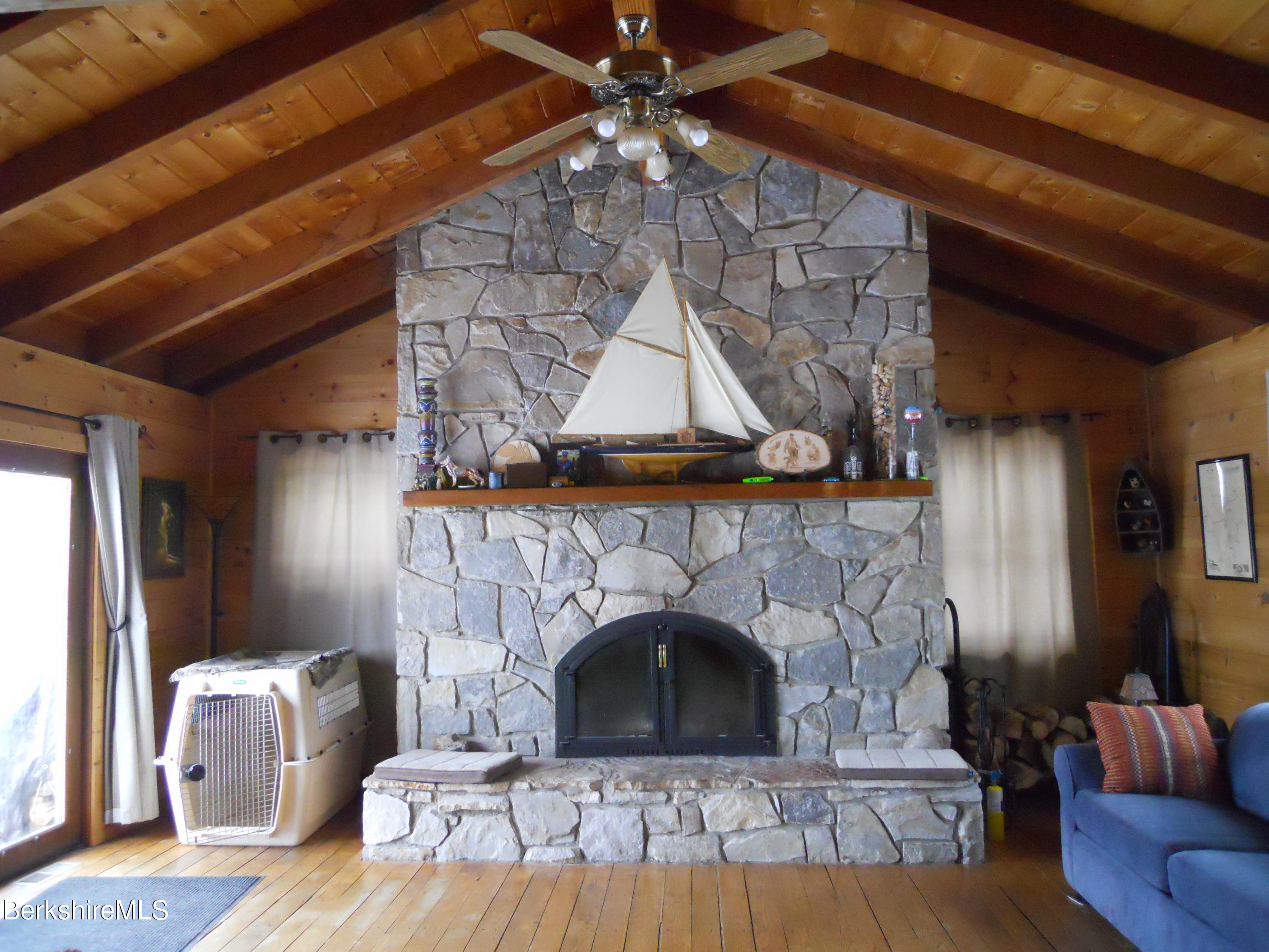 140 Arthur Pease Road Middlefield, MA 01011 - Photo 14 of 43 a living room with furniture and a fireplace