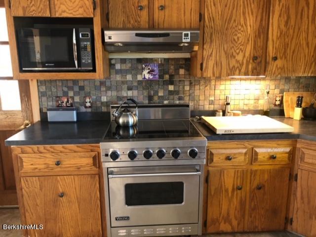 140 Arthur Pease Road Middlefield, MA 01011 - Photo 20 of 43 a kitchen with a stove and a microwave