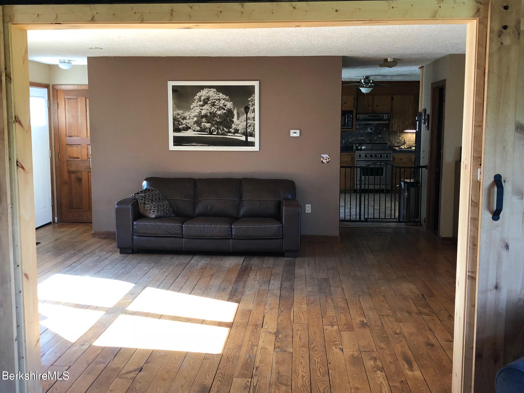 140 Arthur Pease Road Middlefield, MA 01011 - Photo 25 of 43 a living room with furniture and a window