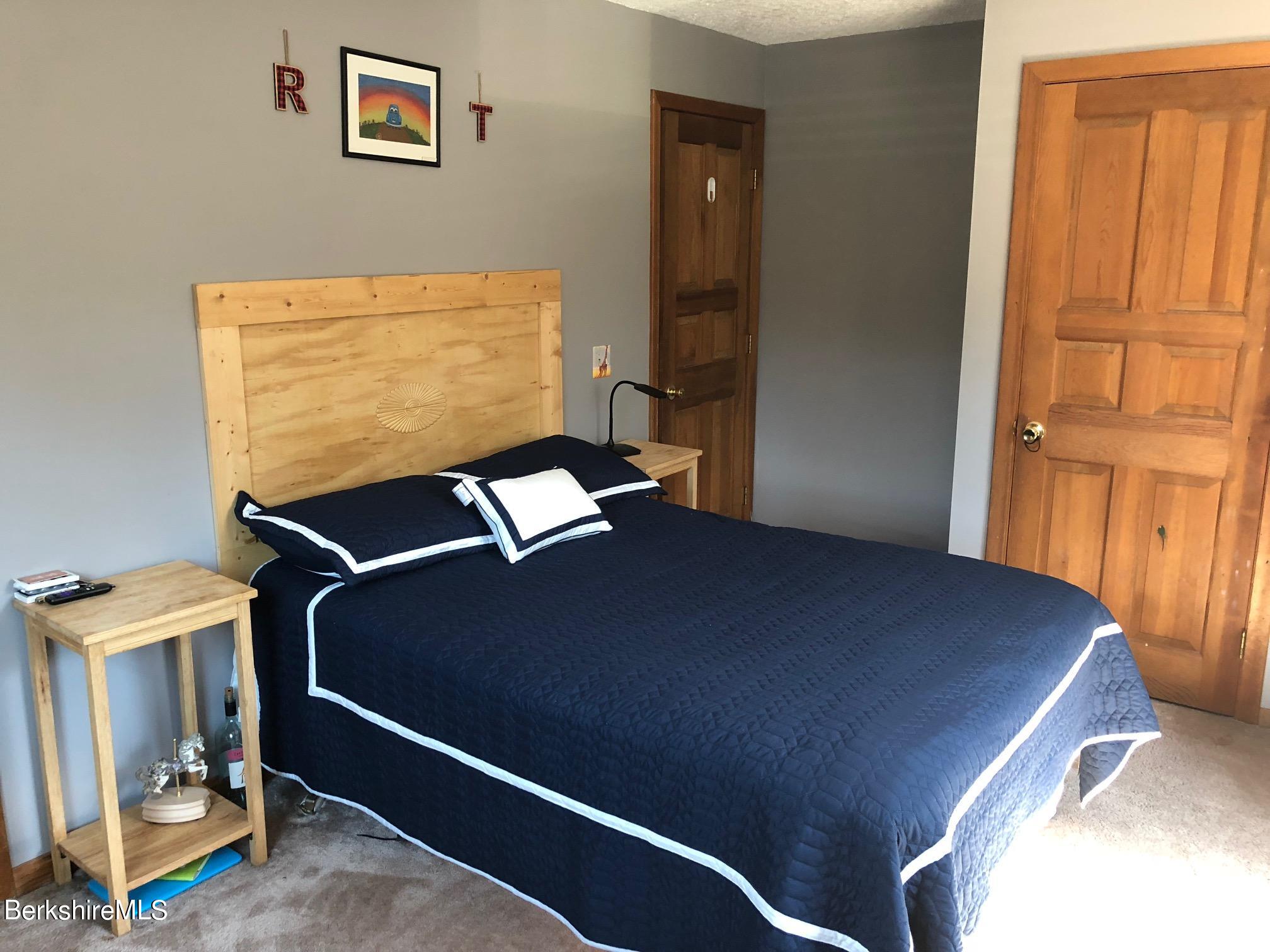140 Arthur Pease Road Middlefield, MA 01011 - Photo 30 of 43 a bedroom with a bed and a window