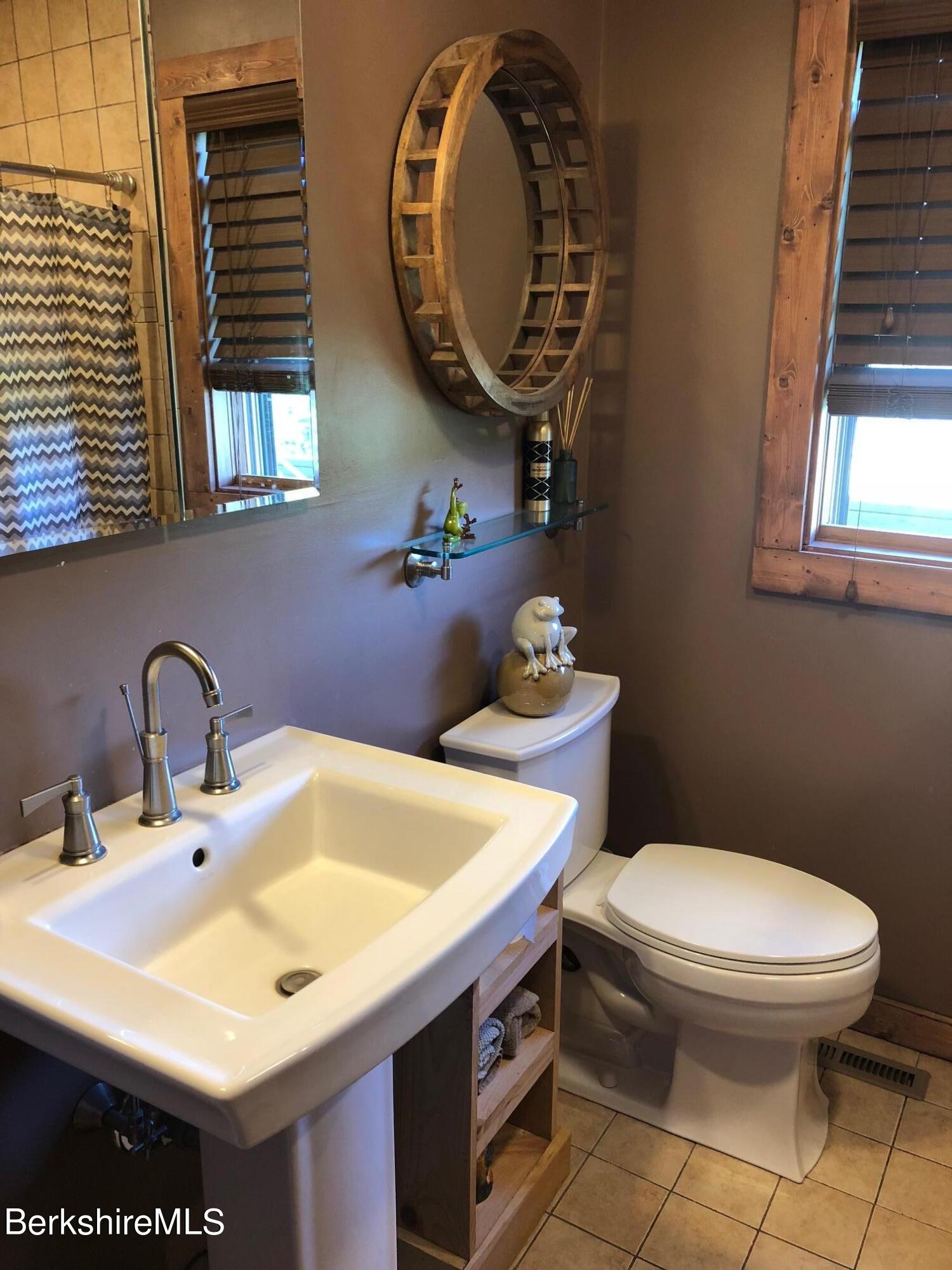140 Arthur Pease Road Middlefield, MA 01011 - Photo 32 of 43 a bathroom with a sink a toilet and a mirror