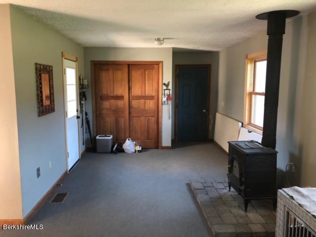 140 Arthur Pease Road Middlefield, MA 01011 - Photo 33 of 43 a view of a room with furniture and a window