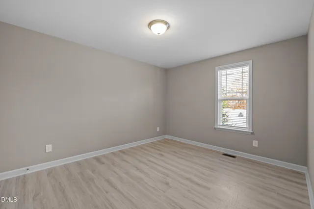 a house view with a backyard space