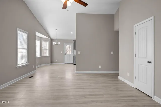 a kitchen with kitchen island granite countertop a sink cabinets and stainless steel appliances