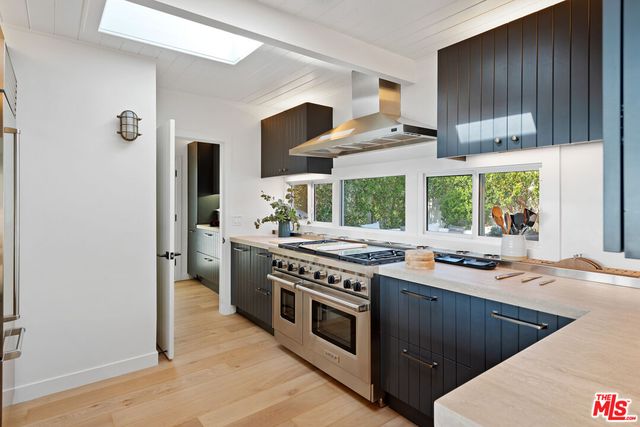 a kitchen with a sink and a window