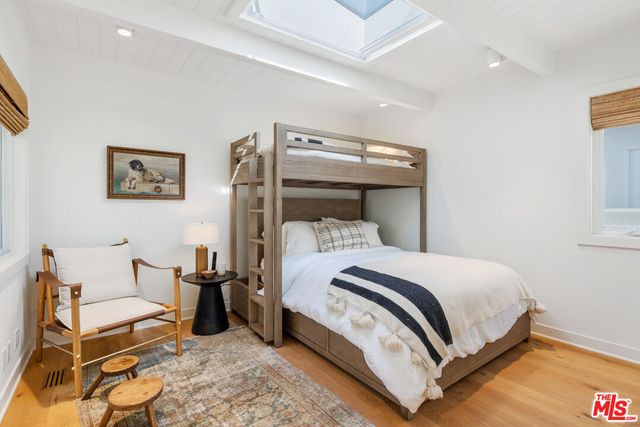 a bathroom with a sink a mirror and a shower