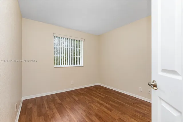 a bathroom with a granite countertop sink a toilet and bathtub