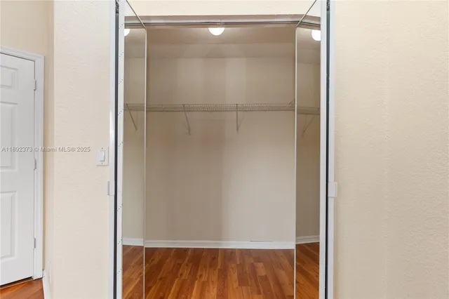 a bathroom with a granite countertop bathtub sink and toilet
