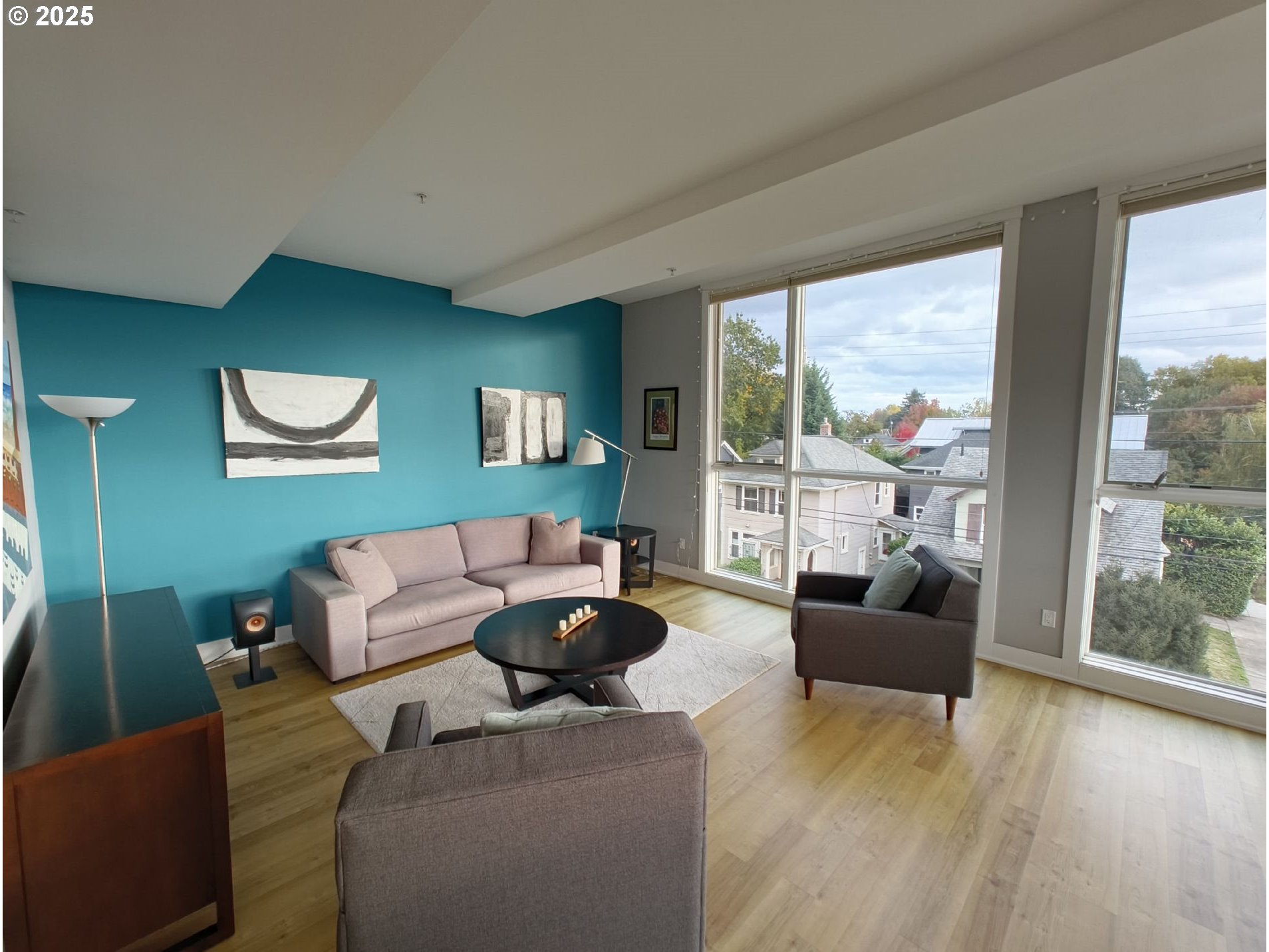 838 Southeast 38th Avenue, Unit 307 Portland, OR 97214 - Photo 2 of 16 a living room with furniture and a large window
