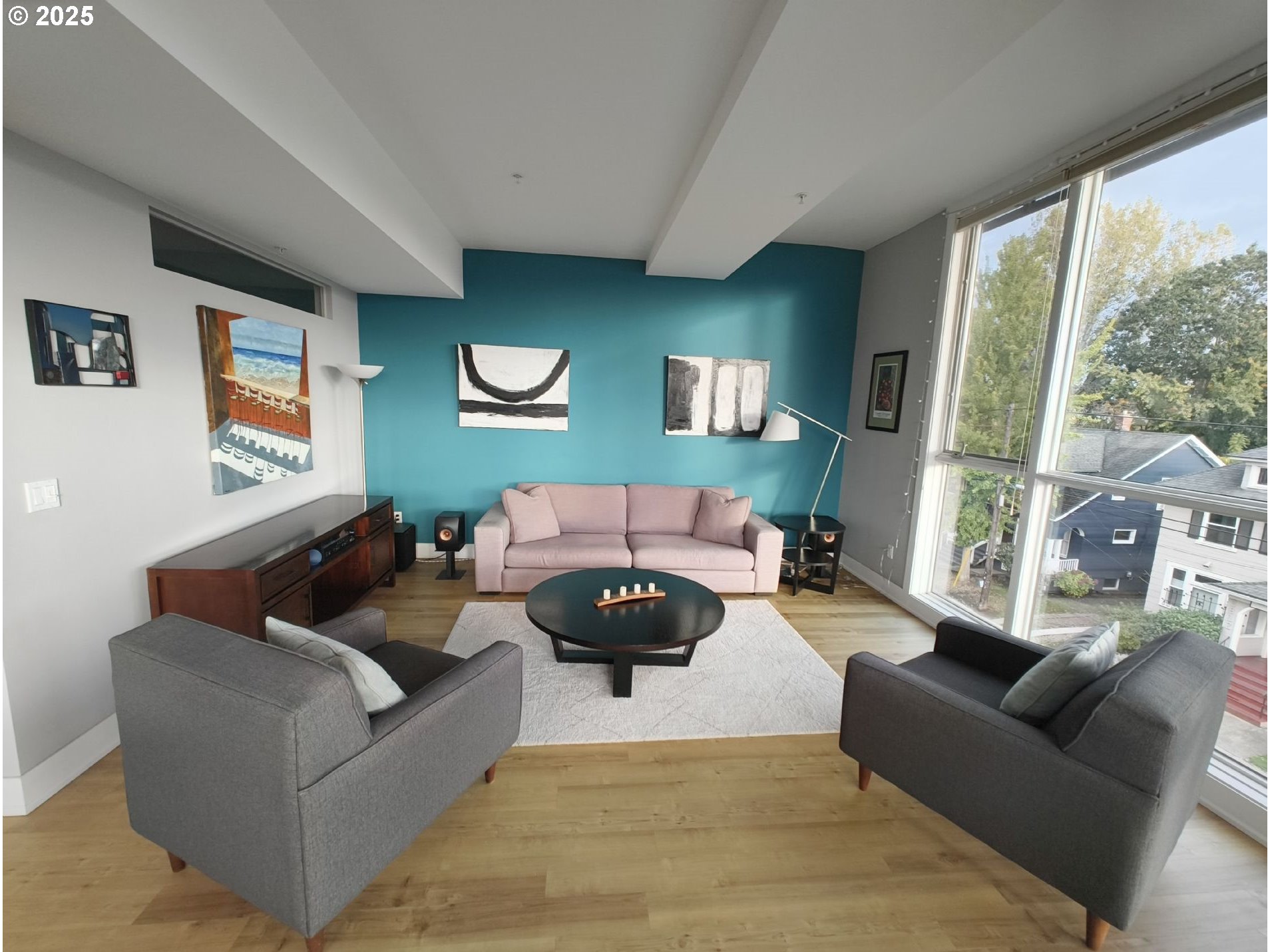 838 Southeast 38th Avenue, Unit 307 Portland, OR 97214 - Photo 3 of 16 a living room with furniture and a large window