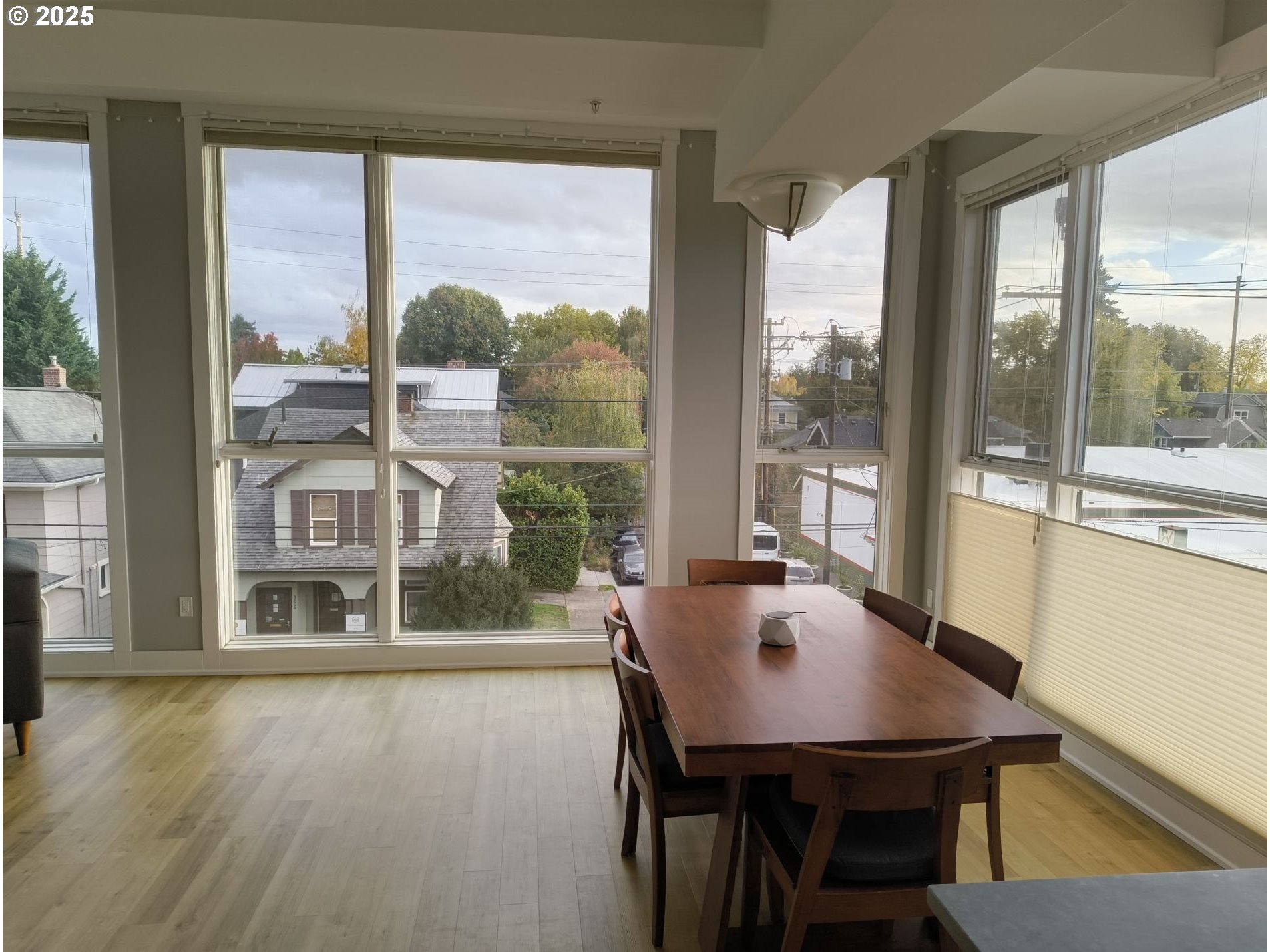 838 Southeast 38th Avenue, Unit 307 Portland, OR 97214 - Photo 4 of 16 a view of a dining room with furniture and window