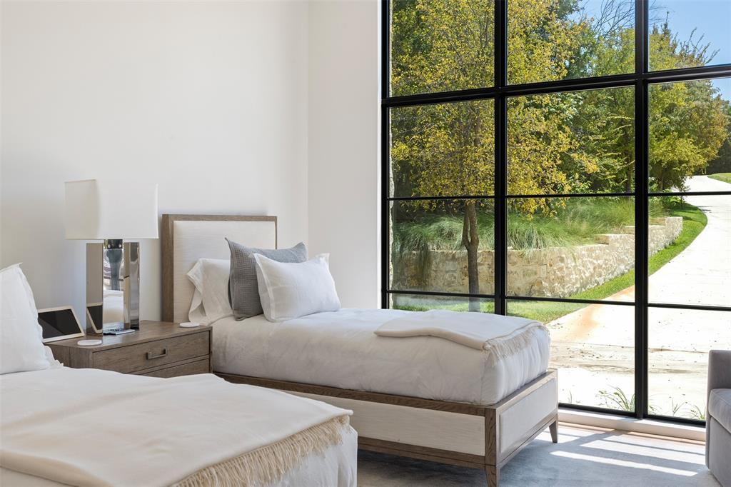 455 Sun Valley Mabank, TX 75147 - Photo 26 of 35 a bedroom with large window and a bed