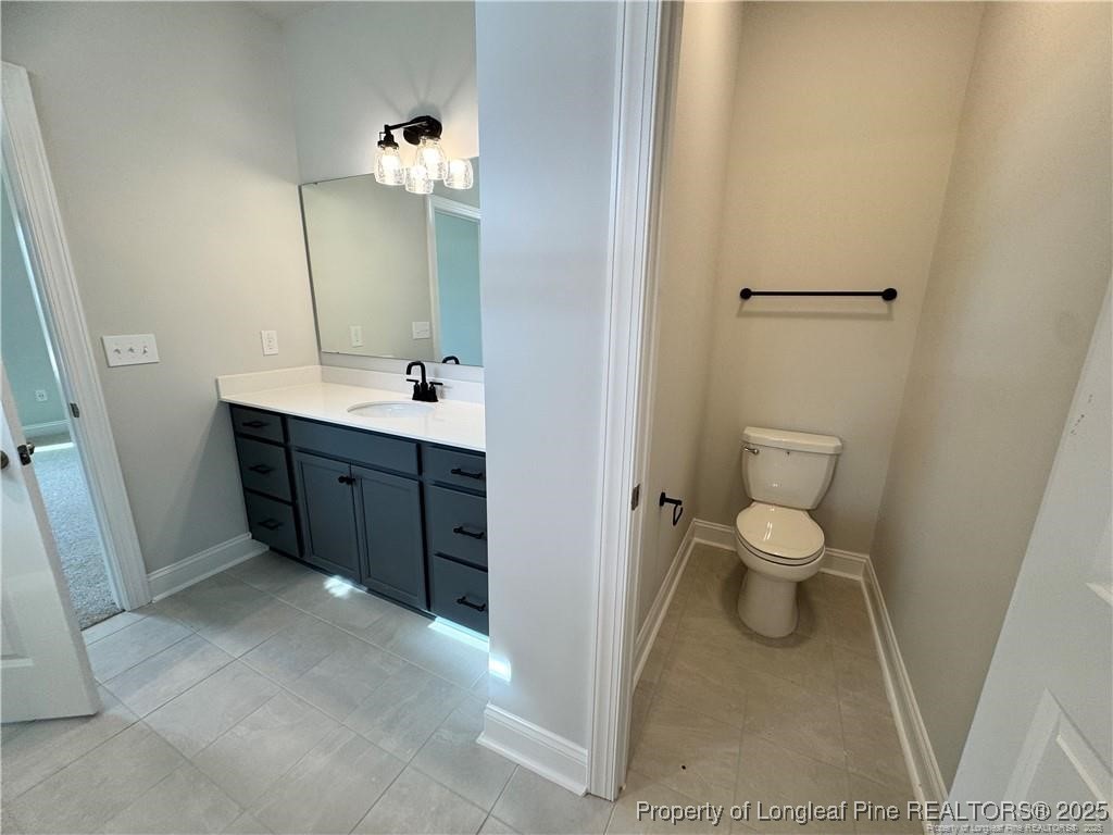 179 Grove Walk Road Raeford, NC 28376 - Photo 19 of 26 a bathroom with a sink and mirror