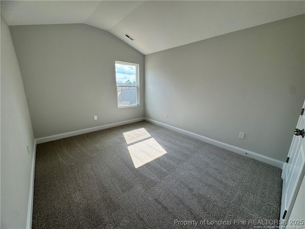 179 Grove Walk Road Raeford, NC 28376 - Photo 20 of 26 an empty room with windows