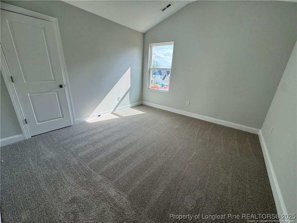 179 Grove Walk Road Raeford, NC 28376 - Photo 21 of 26 an empty room with windows