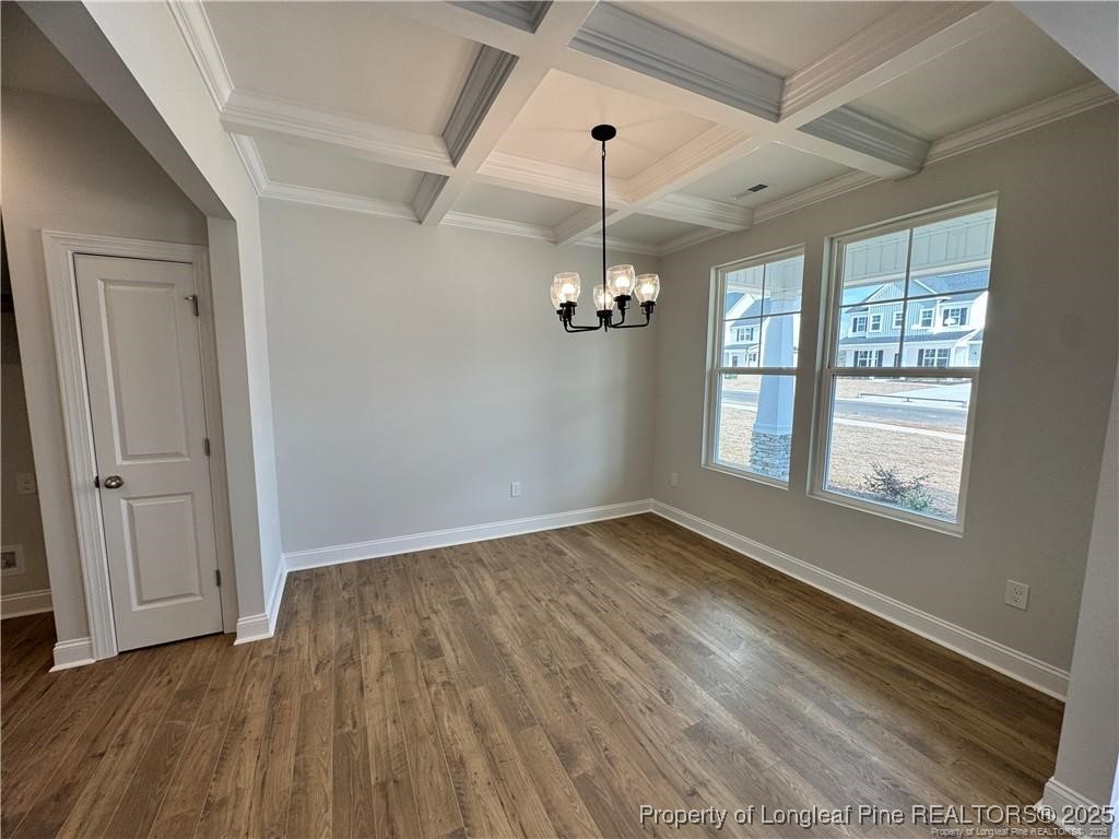 179 Grove Walk Road Raeford, NC 28376 - Photo 3 of 26 a view of an empty room with wooden floor and a window