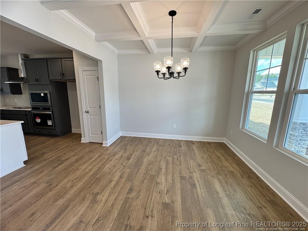 179 Grove Walk Road Raeford, NC 28376 - Photo 4 of 26 a view of empty room with wooden floor and window