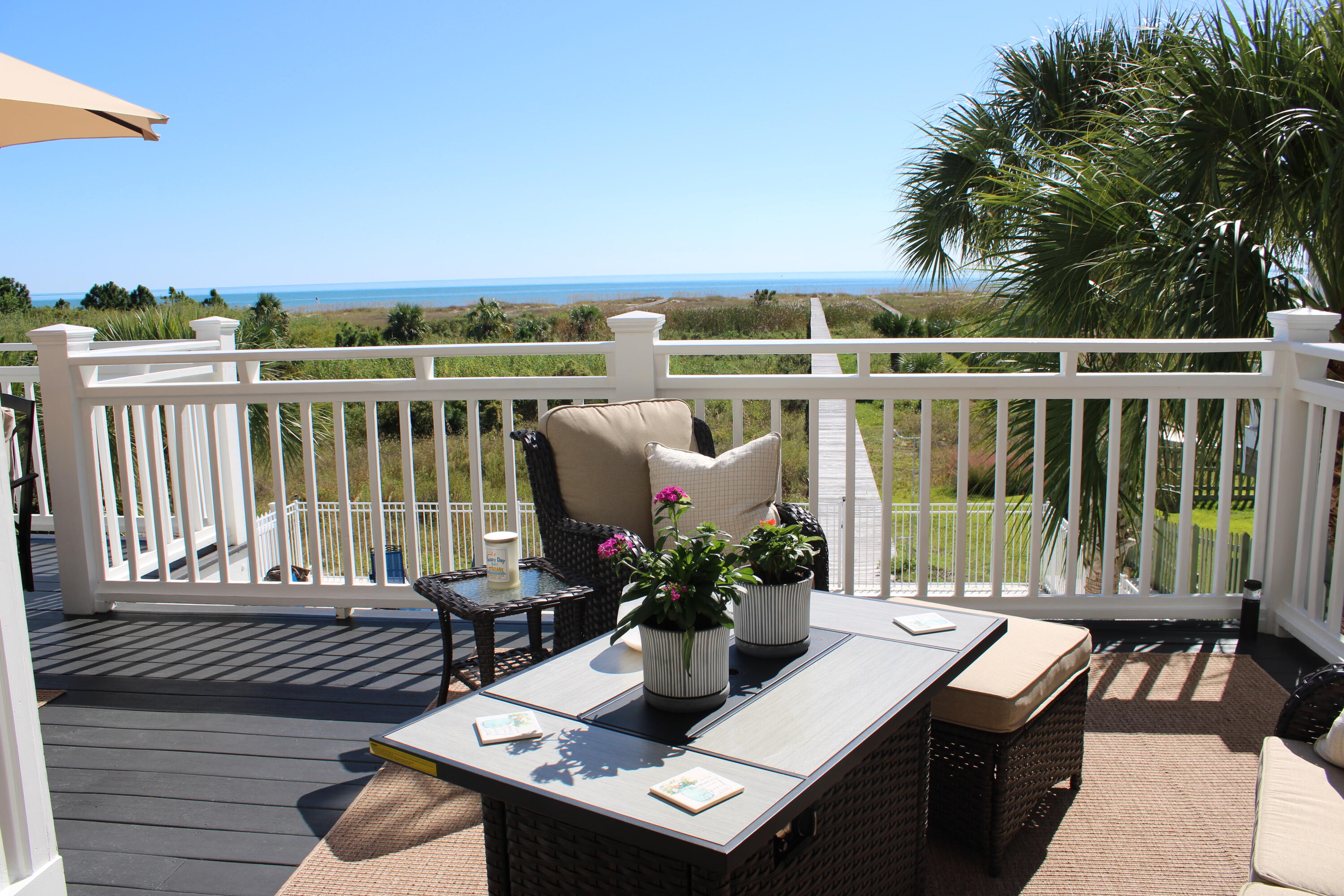 446 Jubilation Drive Port St. Joe, FL 32456 - Photo 15 of 62 a view of a balcony with wooden floor and outdoor seating