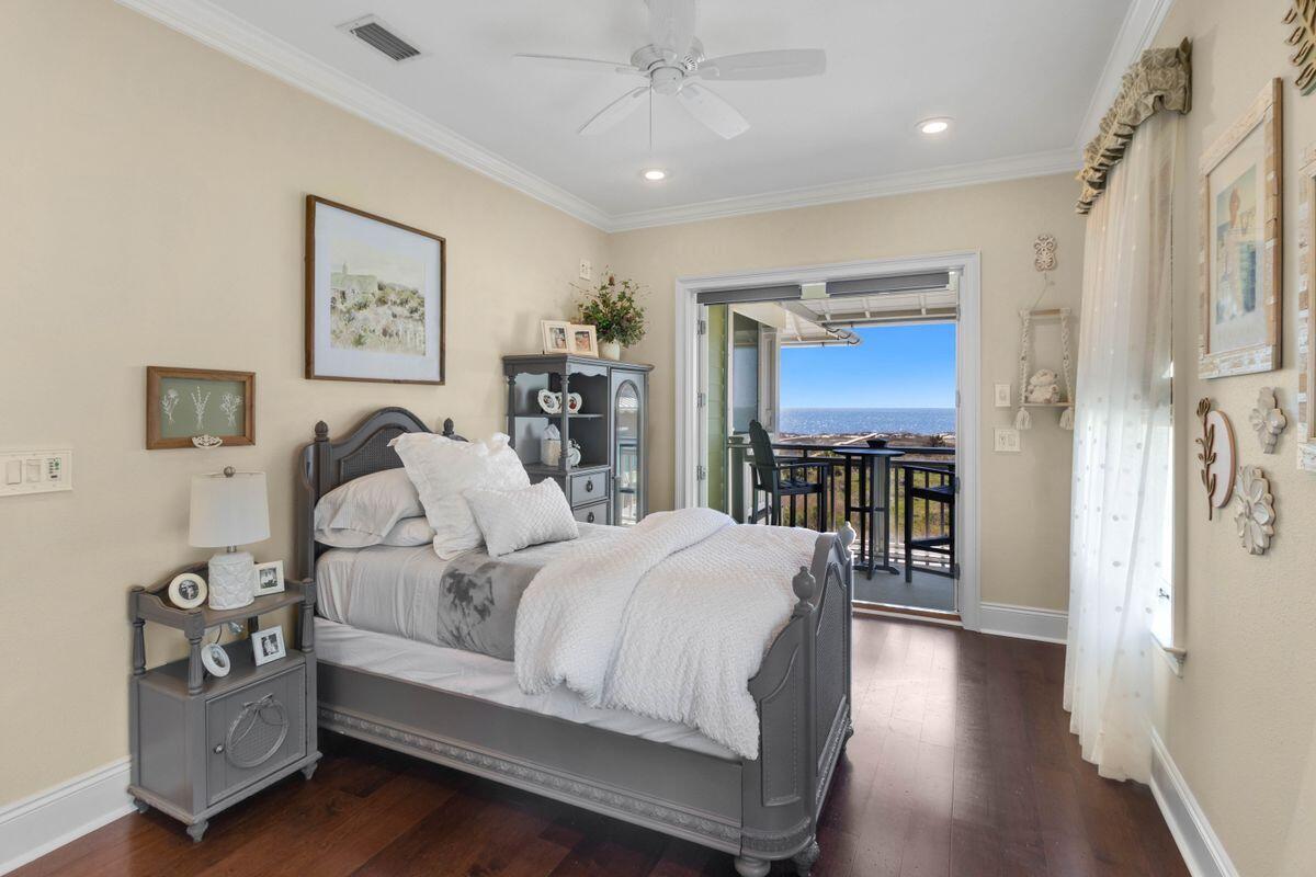 446 Jubilation Drive Port St. Joe, FL 32456 - Photo 34 of 62 a spacious bedroom with a bed and a view of kitchen