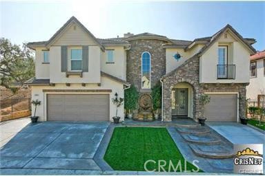 5588 California Oak Street Simi Valley, CA 93063 - Photo 1 of 38 a front view of a house with a garden