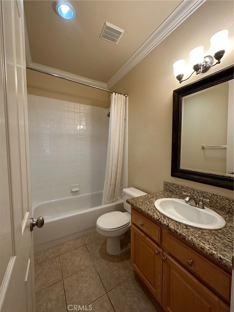 5588 California Oak Street Simi Valley, CA 93063 - Photo 12 of 38 a bathroom with a granite countertop sink a toilet a mirror and shower