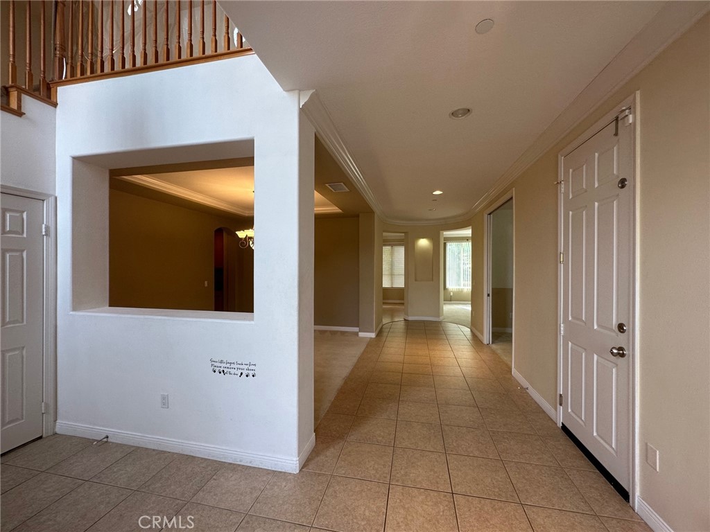 5588 California Oak Street Simi Valley, CA 93063 - Photo 2 of 38 a view of a hallway with wooden shelves